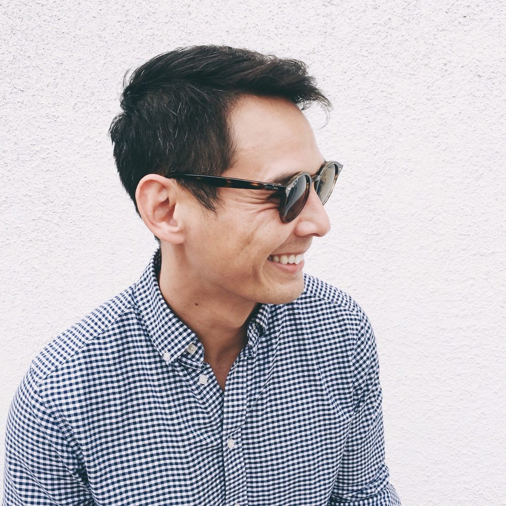 Young man smiling with sunglasses